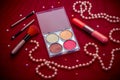 Makeup cosmetic kit on a dark red background Royalty Free Stock Photo